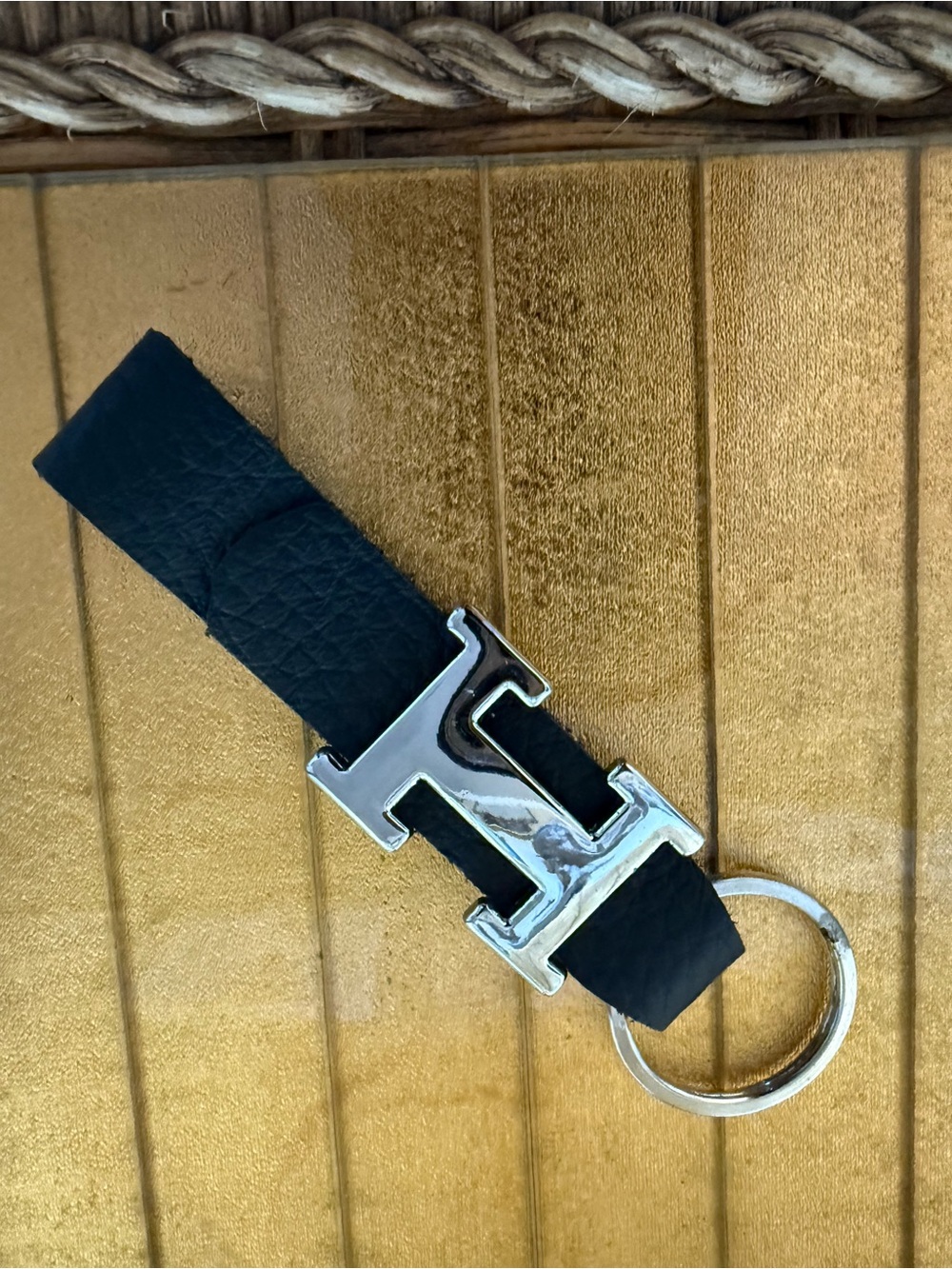 “H” chrome and black leather keychain